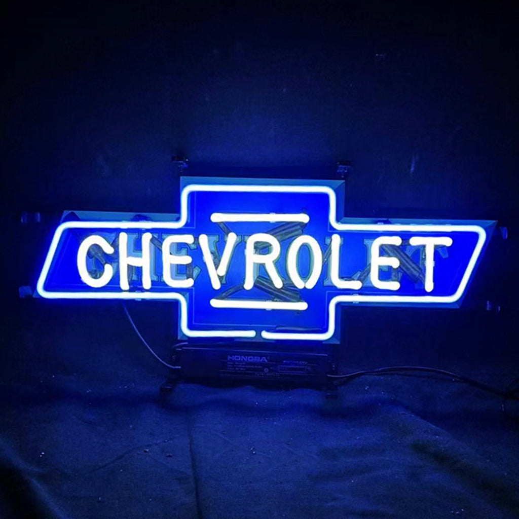 "Geometric bowtie-shaped auto neon light with interconnected diamond patterns in amber glow, paired with bold sans-serif lettering"