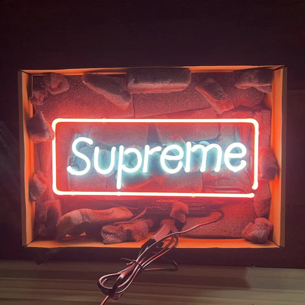 "Supreme neon sign glass - bright and vibrant logo, perfect for bars, game rooms, and man caves."